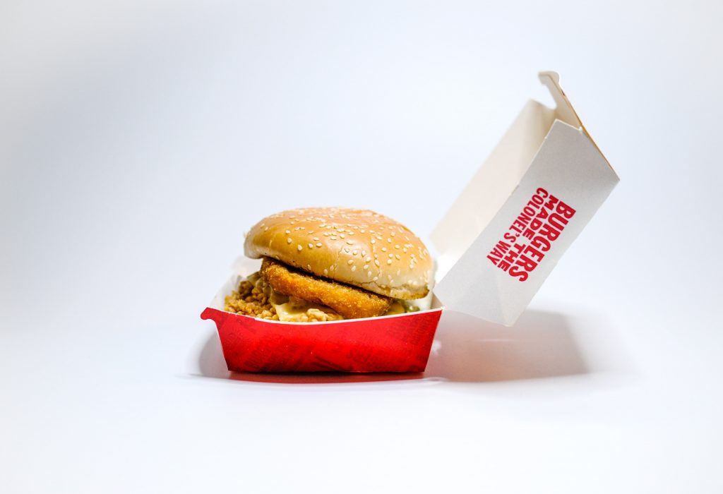 Junk food is loaded with sugars and carbohydrates that can cause acne and other skin issues.